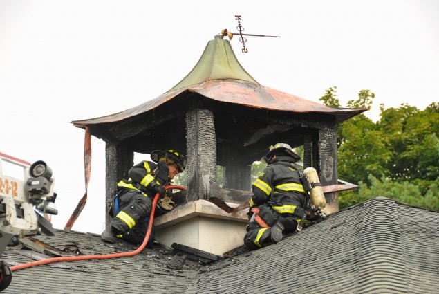 Firefighters on roof