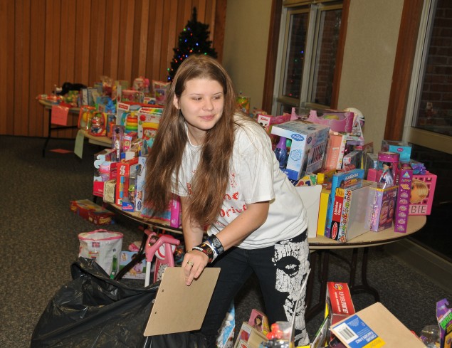 Victoria Plumitallo, busy at work at the Sunshine Toy Drive at the Dix Hills Fire Department.