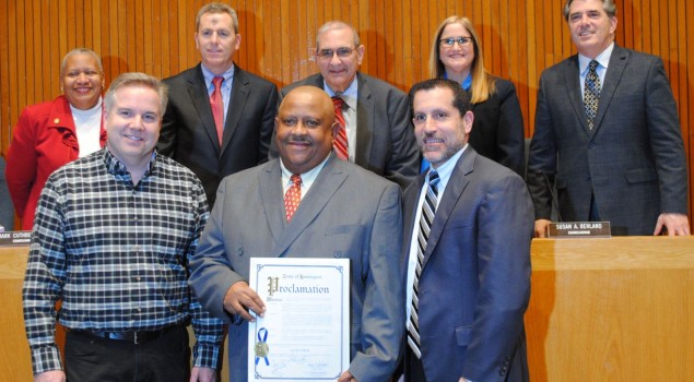 Al White surrounded by HUFSD Board Pres-Tom DiGiacomo Left & Supt-James Polansky